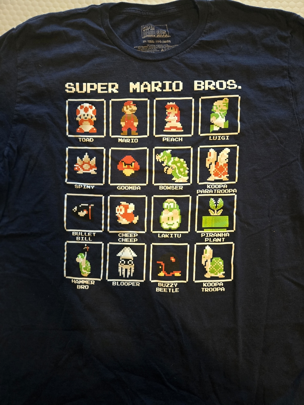 Super Mario Bros. Mena Navy Graphic Tee - Pixel Characters
